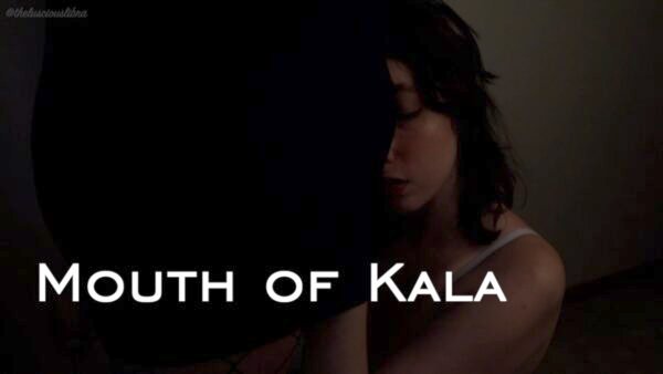 Video still of Kathrine on her knees nuzzling into Kala's bulge title "Mouth of Kala"