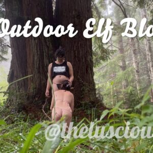 Sofia Verga standing against a redwood while Kathrine Bush kneels to kiss her thigh, text reads "Outdoor Elf Blowjob