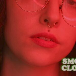 Close up shot of a brunette in glasses watermark "Smoking Close Up @thelusciouslibra"