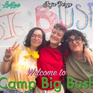 Three femmes standing in front of a decorated van, one is wearing yellow, another red, and the last green. Multicolored text reads: Lucy LaRue Sofia Verga Kathrine Bush "Welcome to Camp Big Bush"